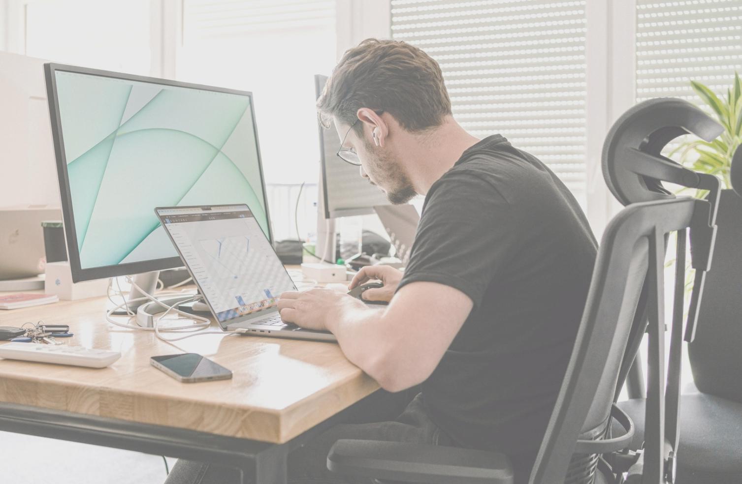 Advanced game development workspace showing multiple monitors with code, game engines, and debugging tools